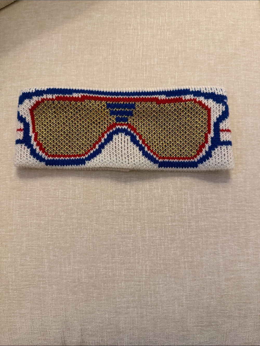 Aldo White Knit Headband with Gold Sunglass Motif and Blue-Red Trim